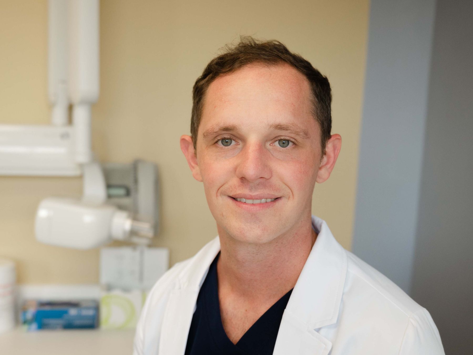 madison dentist dr paul wehner smiling in his white coat