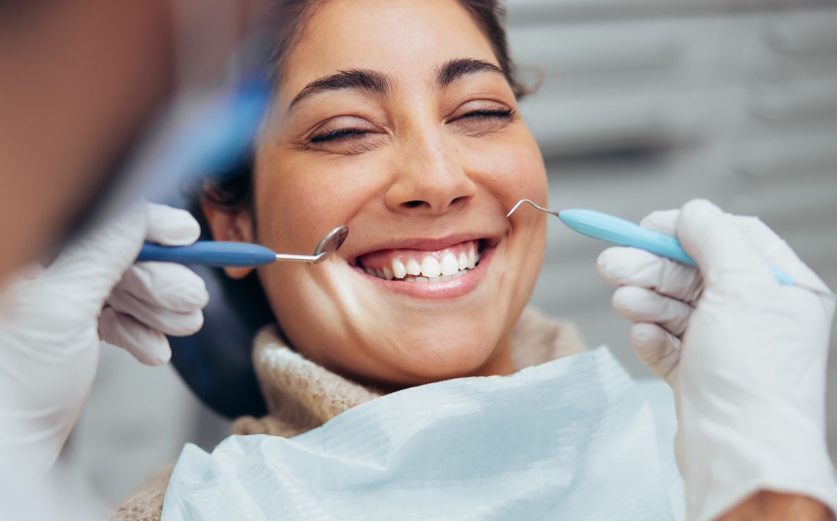 dental crown patient model smiling in the dental chair