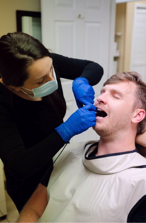  madison dental hygienist treating a patient model