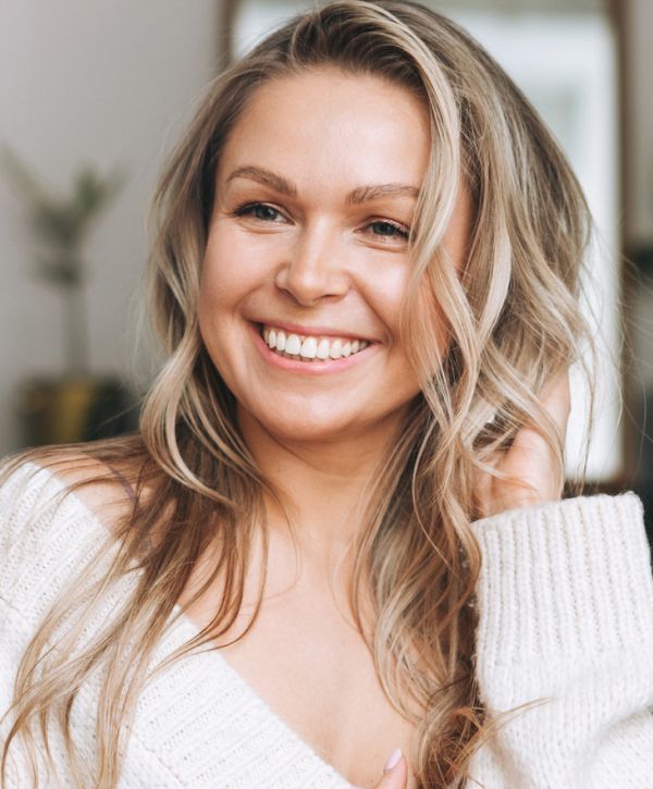 blonde tooth extraction patient model smiling broadly