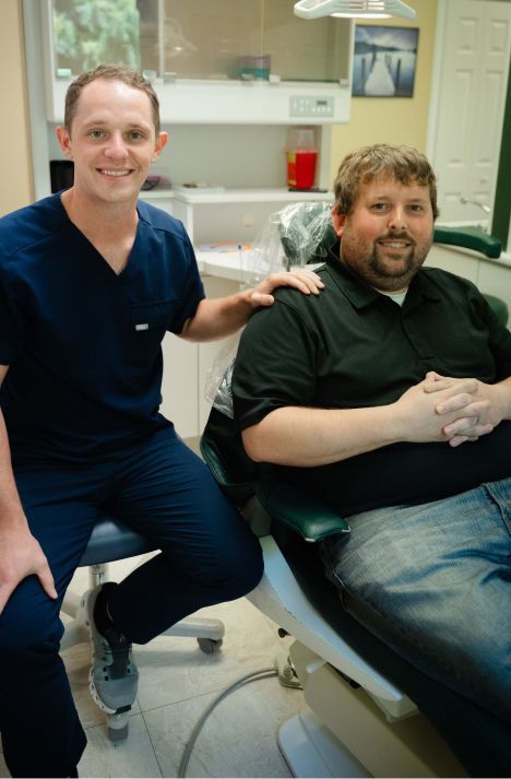 madison dentist dr paul wehner consulting with a patient model